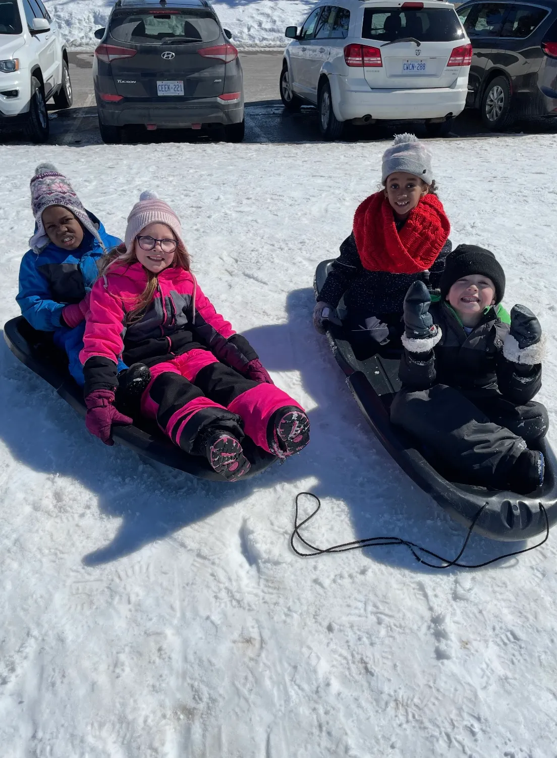 Photo of daycare kids tobogganing